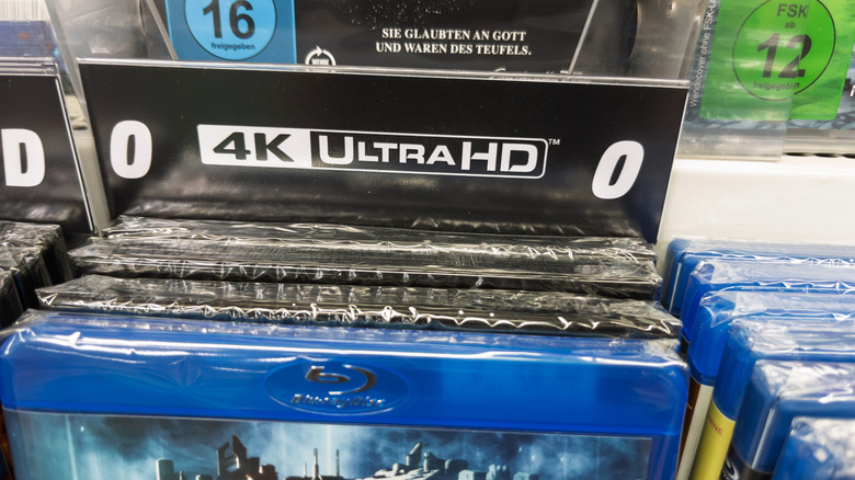 A stack of 4K Ultra HD Blu-Ray discs in a store.