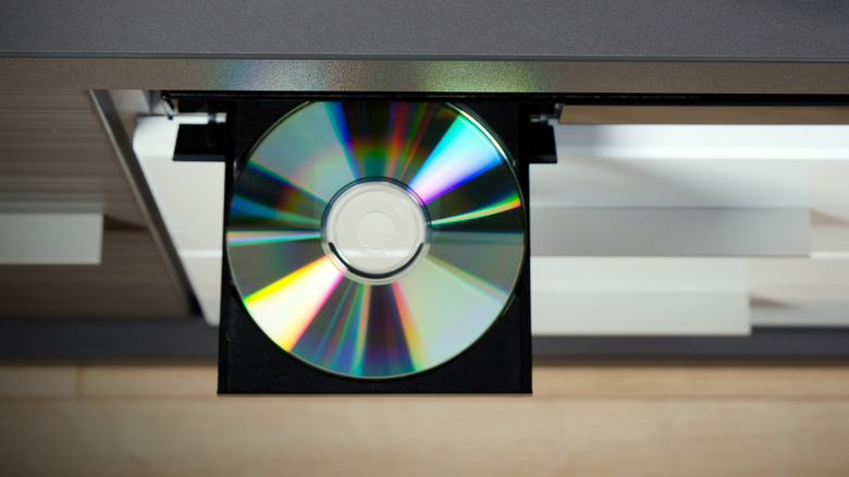 A disc drive on a Blu-Ray player showing an optical disc.
