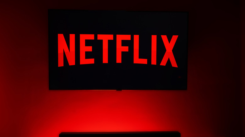 A Netflix logo displayed on a TV with a red background.