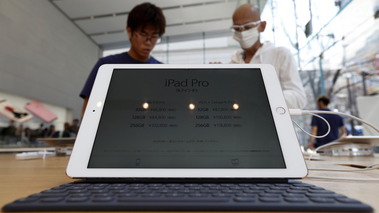 The first 9.7-inch iPad Pro model sits on display at an Apple Store in Tokyo, Japan.