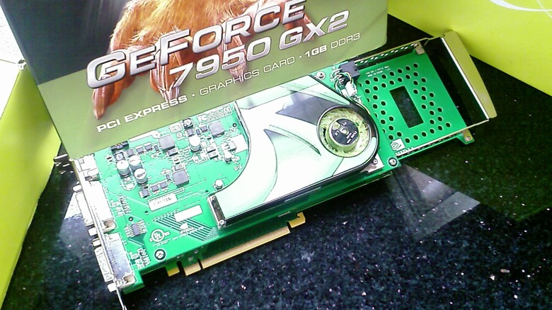 GeForce 7950 GX2 graphics card with box on black tabletop