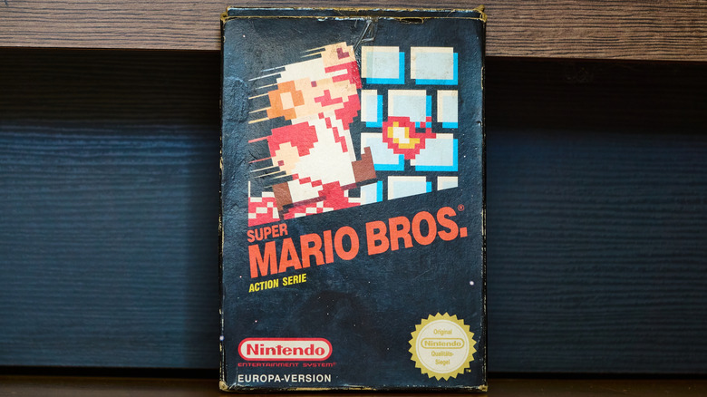 The original Super Mario Bros game box in shabby condition