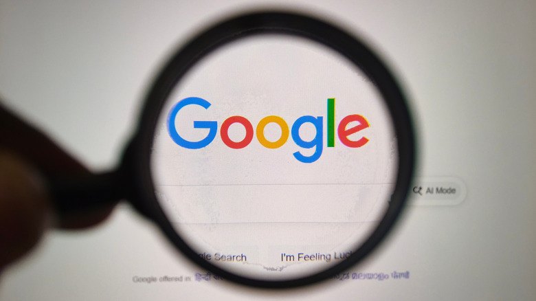 A magnifying glass over a Google logo