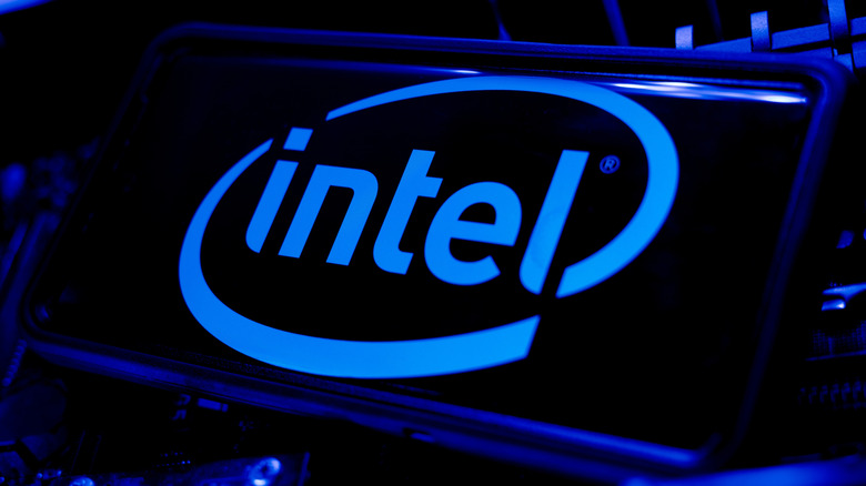 The Intel logo on a smartphone doused in blue light