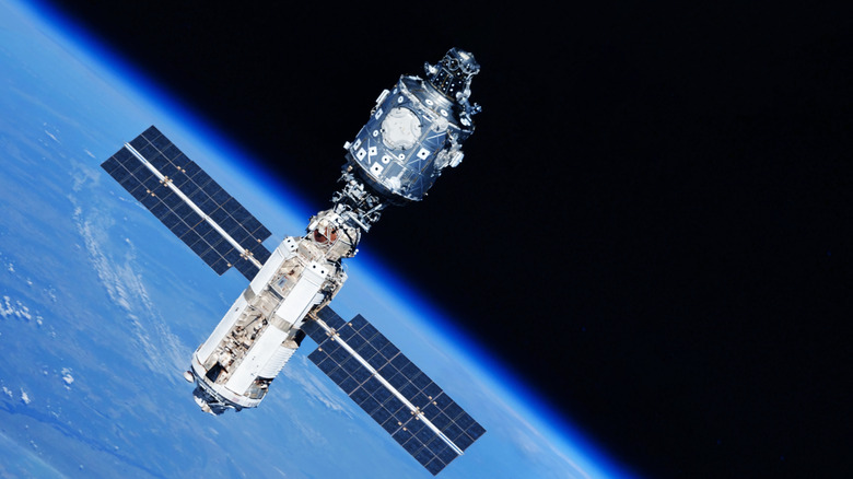 A space satellite above the Earth's surface.