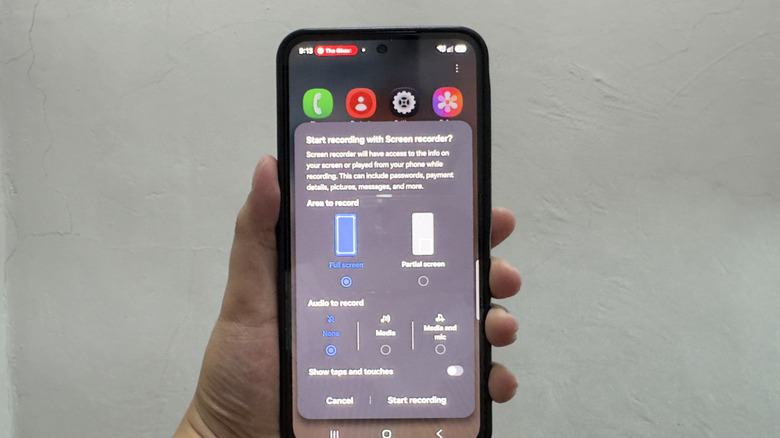 Hand holding Samsung Galaxy showing screen recording setup