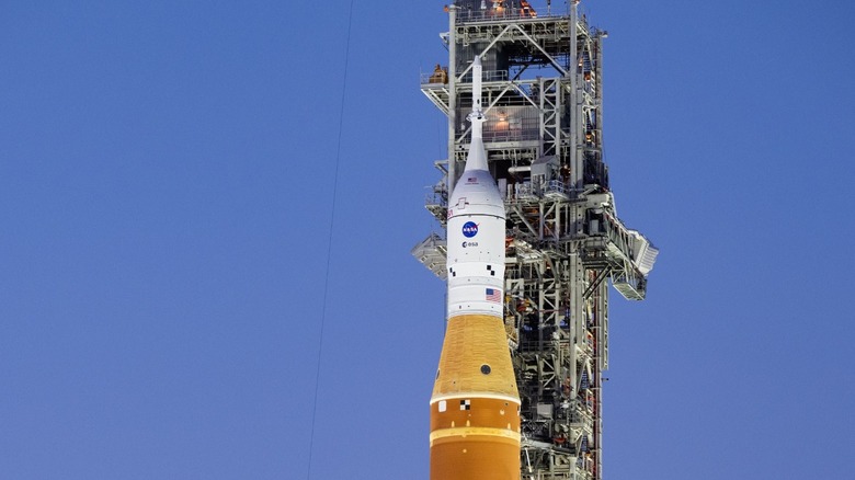 Artemis II is seen, against a blue sky.