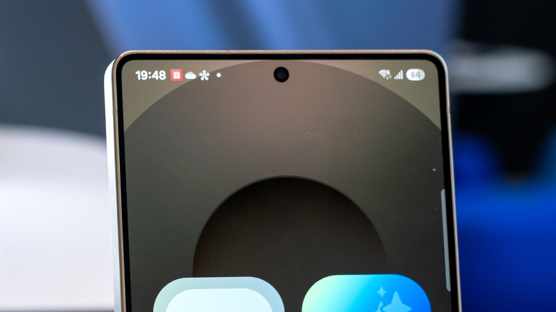 An Android phone screen with a white dot on the notification bar