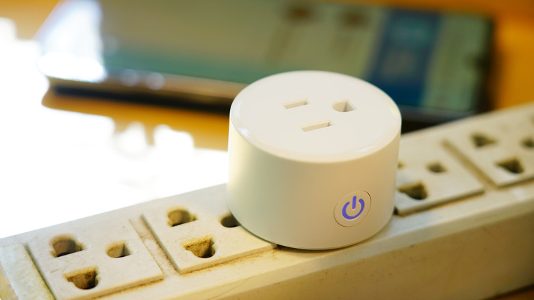 A smart plug connected to a power strip