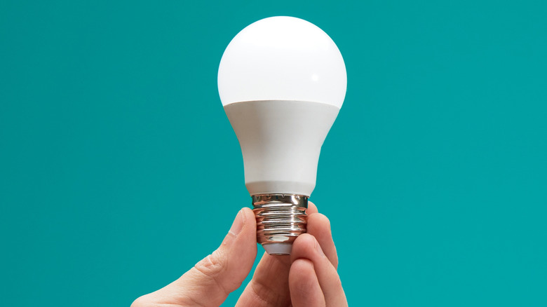 Person changing lightbulbs