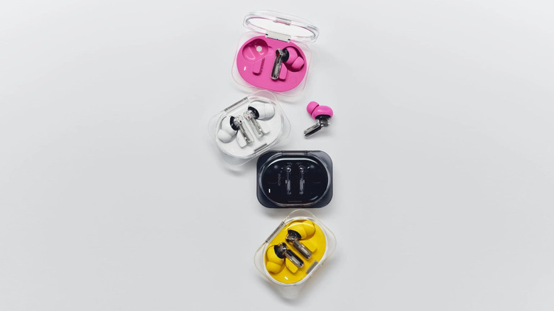 Four Nothing Ear 3a wireless earbuds units showing the different color options