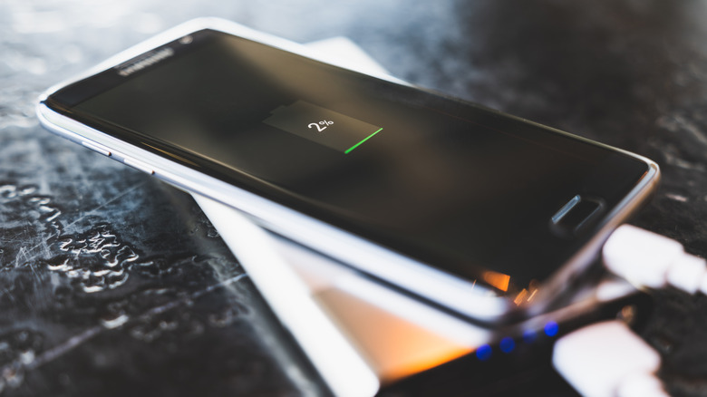 a phone with low battery being charged