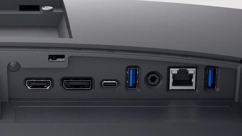 The underside of a Dell Ethernet monitor with ports for HDMI, DP, USB-C, USB-A, audio, and Ethernet.