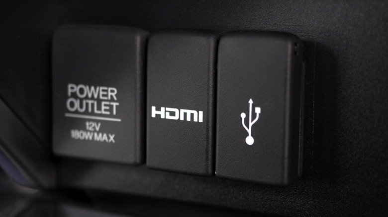 close-up of HDMI port and USB port in a car dashboard