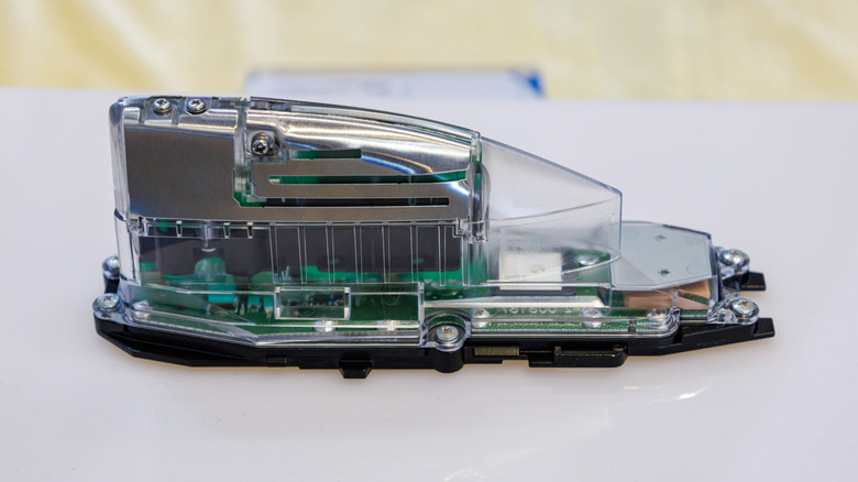 Shark fin antenna in transparent case showing internals