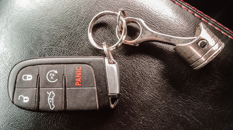 A key fob on a table attached to a keychain.
