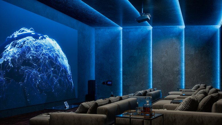 Home cinema with projector projecting images onto wall