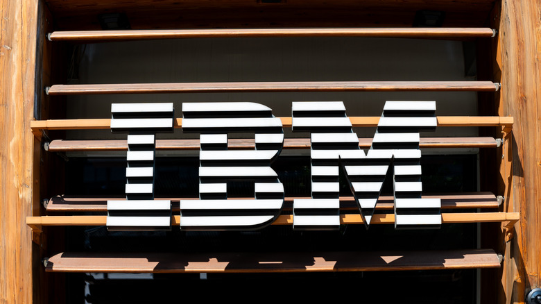 A close-up of the IBM logo on wood window shutters