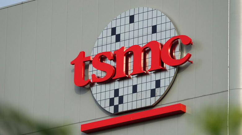The logo for Taiwan Semiconductor Manufacturing Company (TSMC) on the side of a building