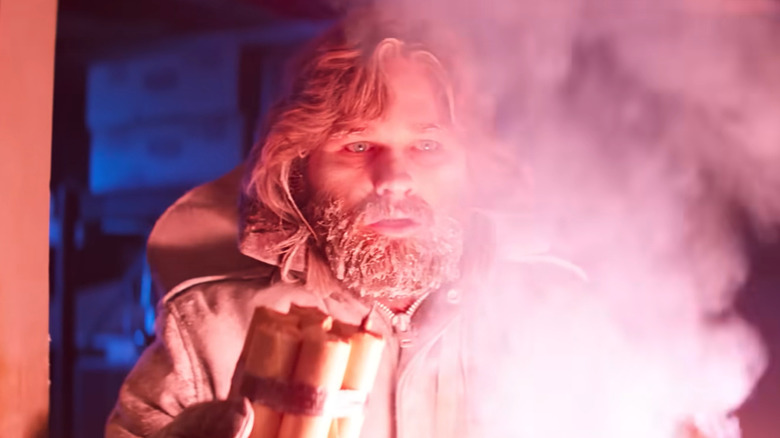 Mac from The Thing (1982) holding dynamite with an intense expression