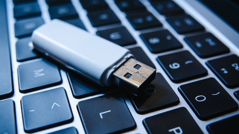 Close-up of USB drive on computer keyboard