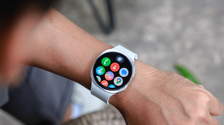 person looking down at menu of galaxy smartwatch