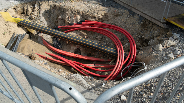 Various buried utility cables.