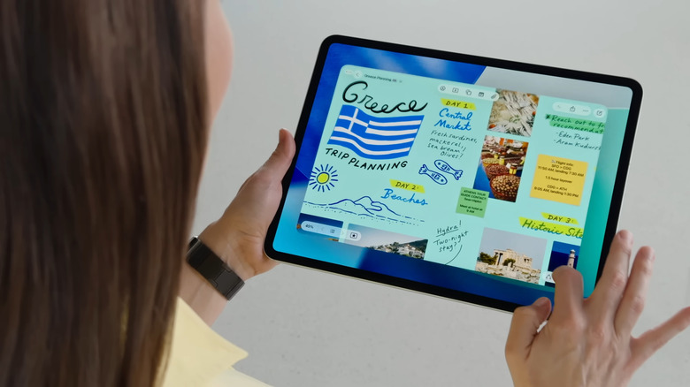 Woman holding iPad showing Notes app