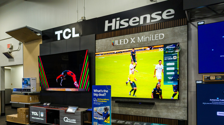 TCL and Hisense TVs on display in a retail store