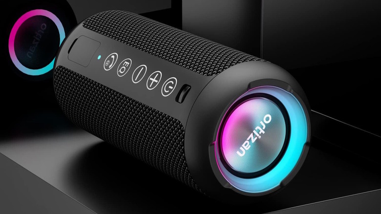 Ortizan Portable Bluetooth speaker on its side with the sound on with lights