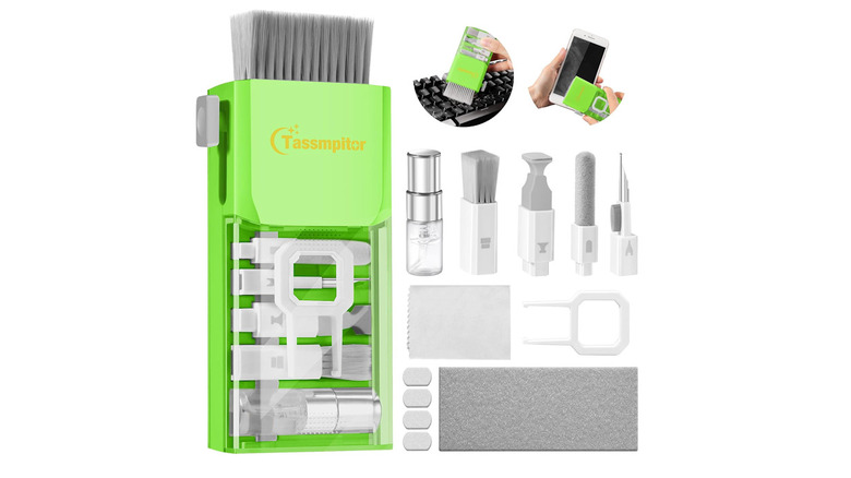 The cleaning kit with all tools pulled out, cleaning a keyboard and a smartphone screen