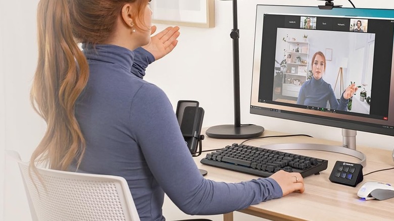 Elgato Stream Deck Mini on the desk while a woman is in a video call