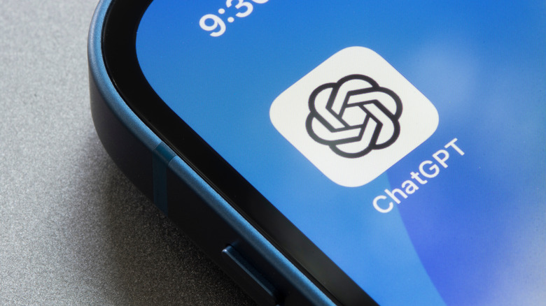 ChatGPT app icon visible on smartphone.