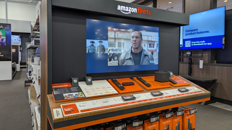 A display of Amazon Fire TV devices at a store.