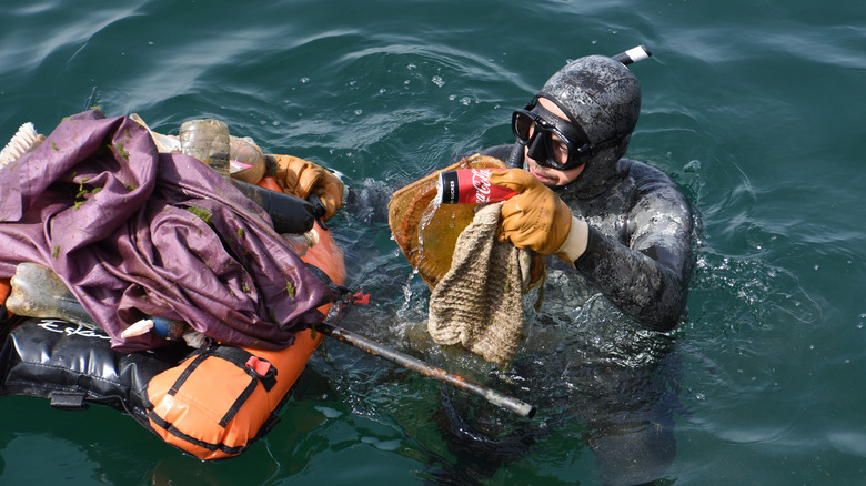 a diver in Marseilles cleaning up plastic in the water