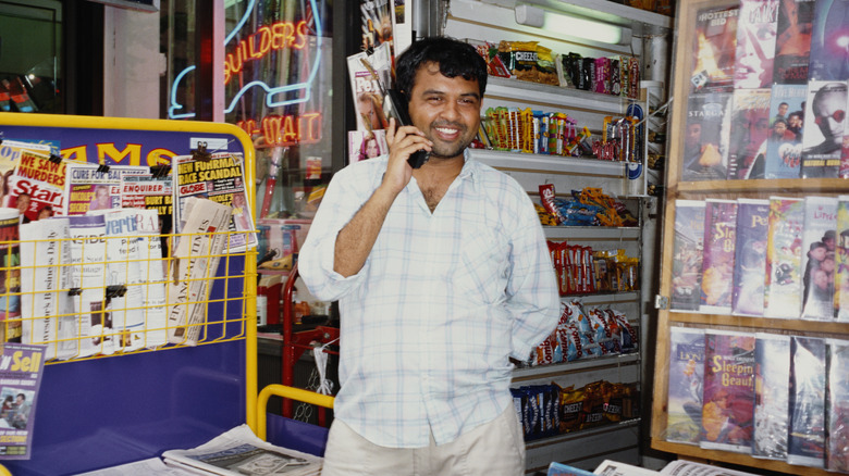 A man in New York talking on a cellphone in the 1990s.