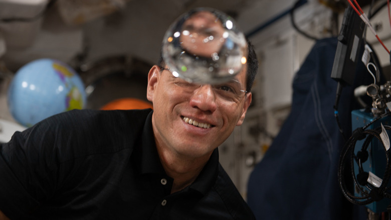 NASA astronaut Frank Rubio seen with a water bubble on the ISS