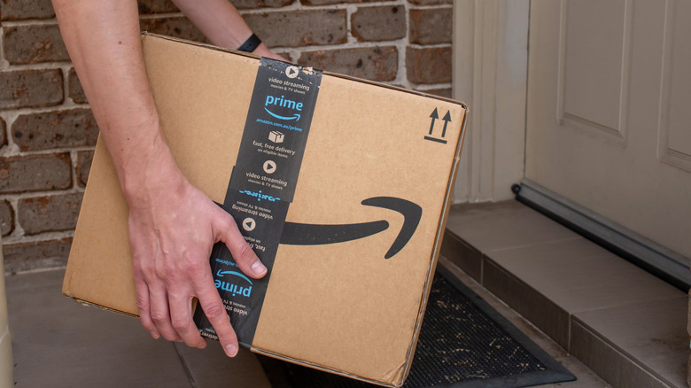 an Amazon Prime package getting set by a front door