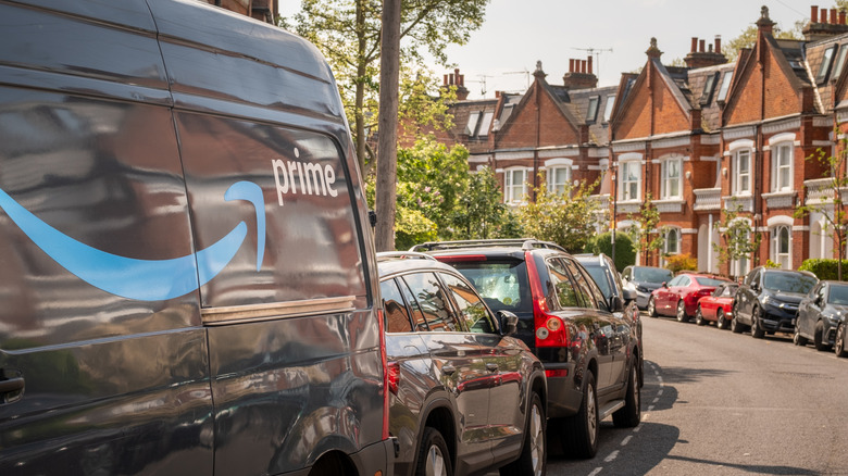 an Amazon prime van on a neighborhood street