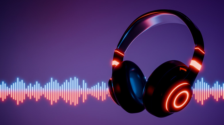 Black headphones with glowing red lights floating in front of an artistic audio wavelength background