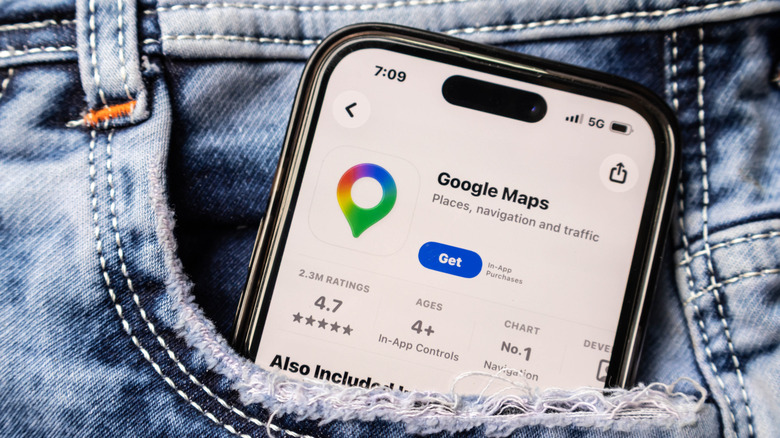 Google Maps on phone display sticking out of a pants pocket.