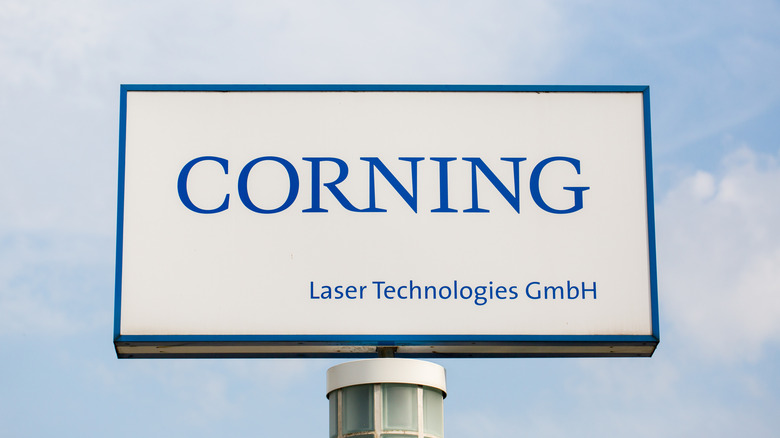 A sign with the Corning Laser Technologies logo.