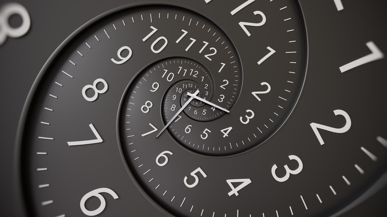 Image of a spiraling black clock numbers 1 to 12, demonstrating time dilation