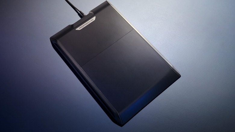 The wireless charging base plate for the 2026 Porsche Cayenne Electric is pictured.