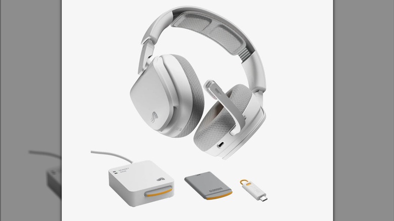 Glorious InfinityPlay wireless headset with hot-swappable battery and dongle in front of white background