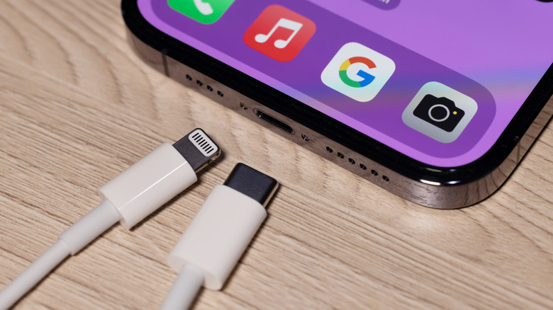 Lightning and USB-C cables near iPhone charging port