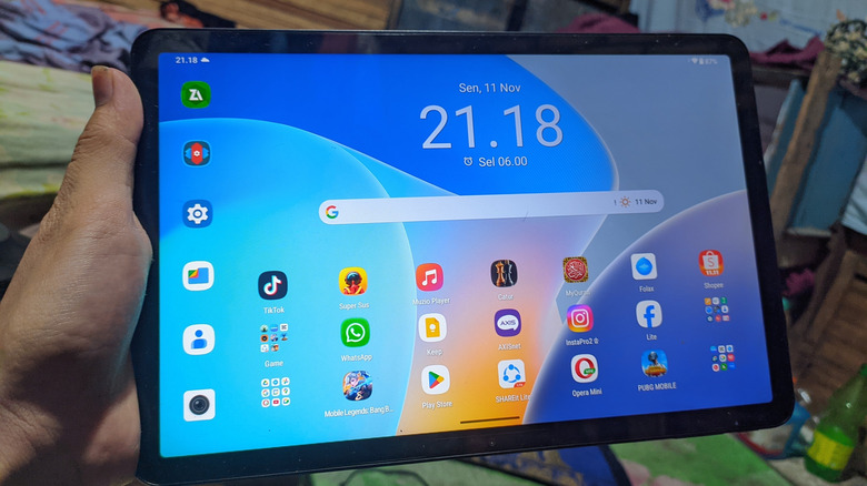 Person holding an Android tablet.