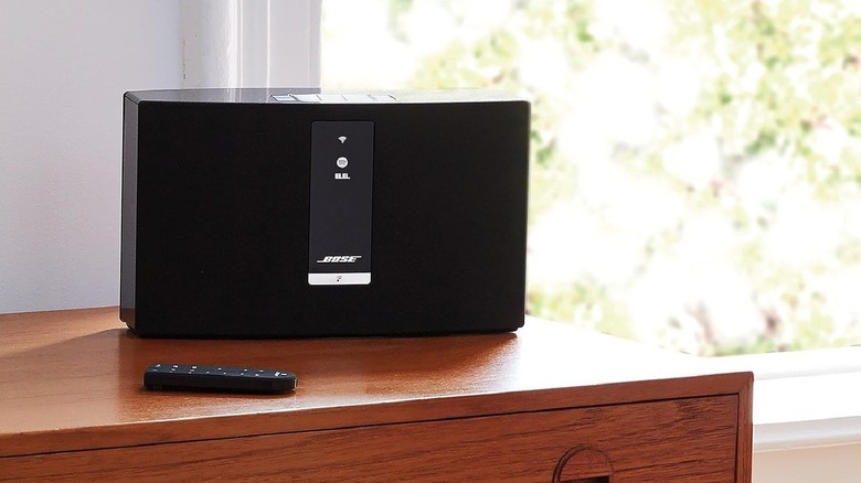 A Bose SoundTouch 20 Series III wireless speaker on a shelf.