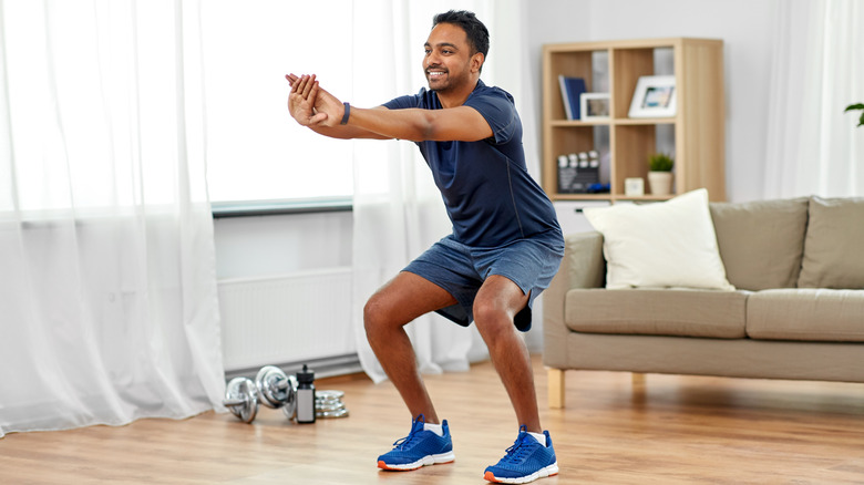 Man working out while wearing a fitness tracker.
