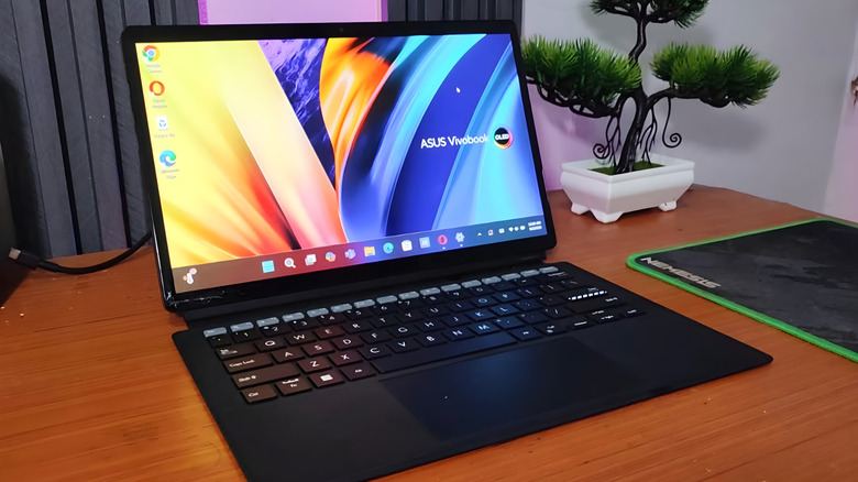 An ASUS laptop with an OLED screen